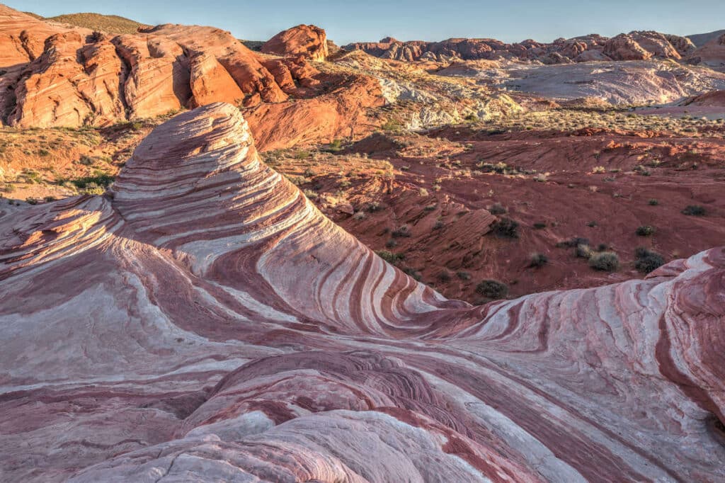 Red and pink waves in sandstone rock formations on the Fire Wave Trail in Valley of Fire State Park, Nevada